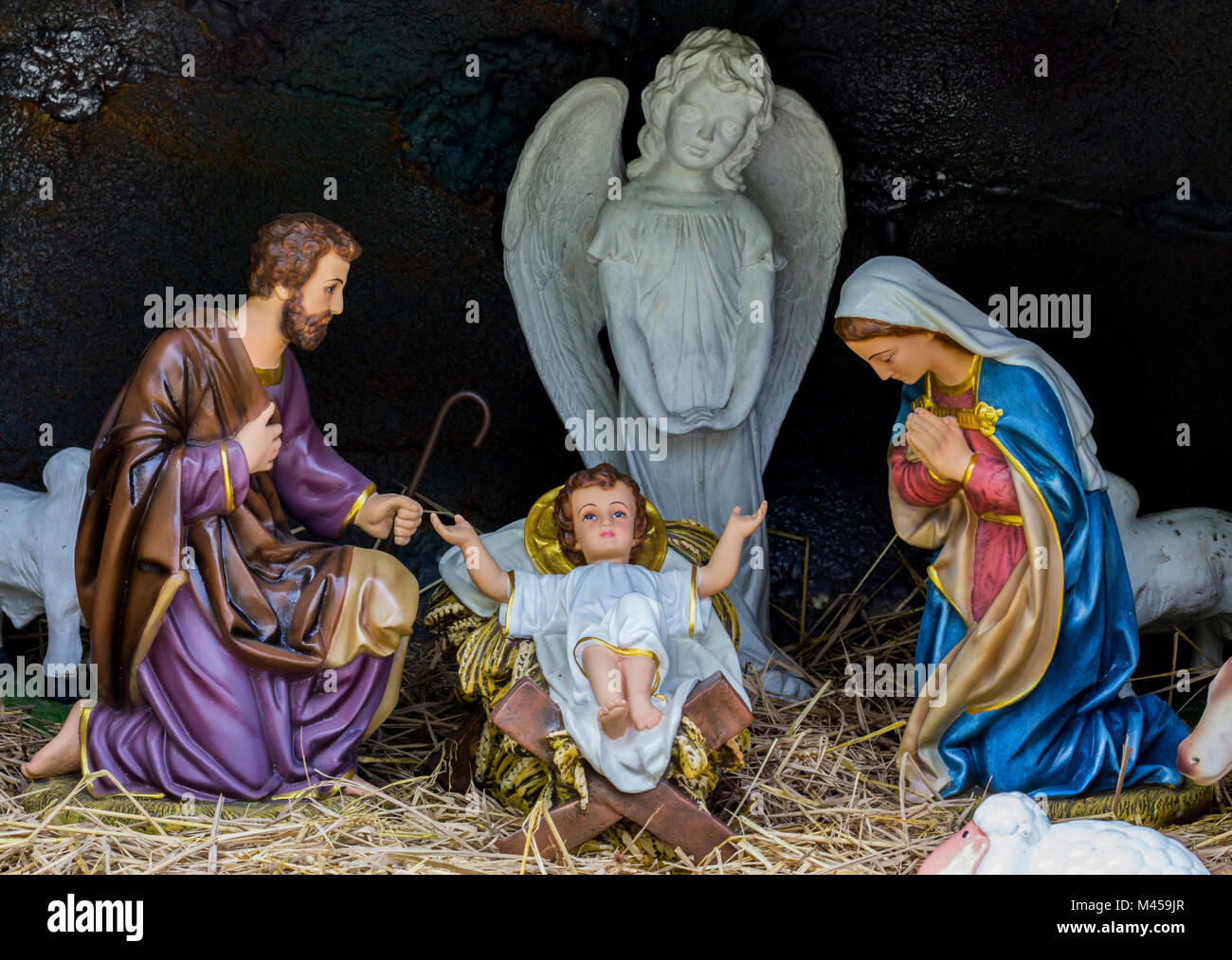 Close up of man statue and woman statue and baby statue and white angel statue in the cave for Christmas day. Stock Photo