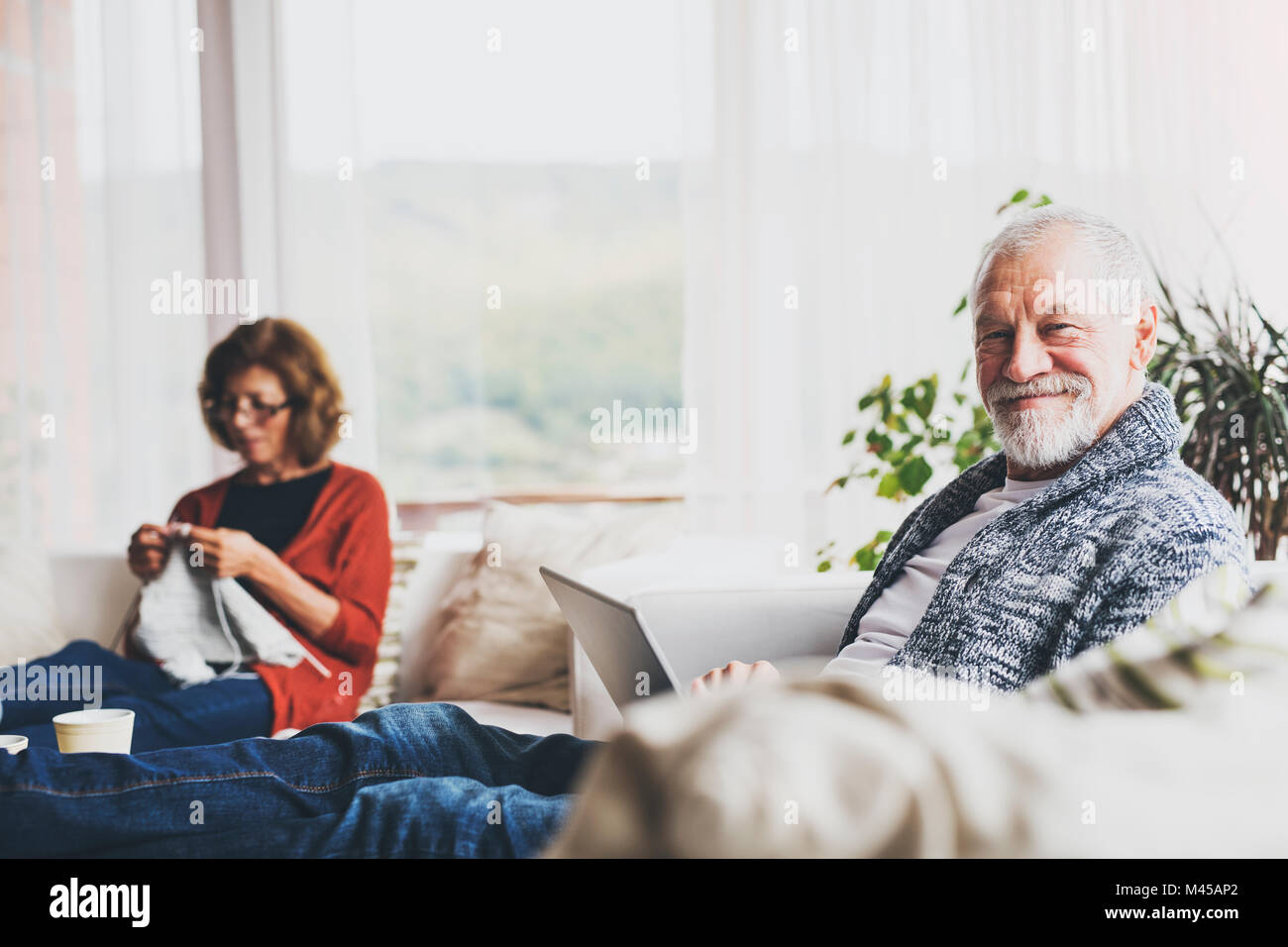 Senior couple relaxing at home Stock Photo - Alamy