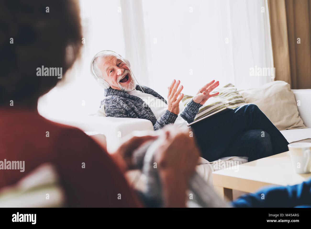 Senior couple relaxing at home Stock Photo - Alamy