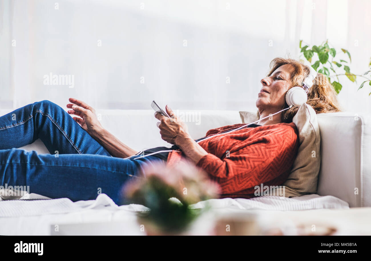 Happy woman home mature hi-res stock photography and images - Alamy