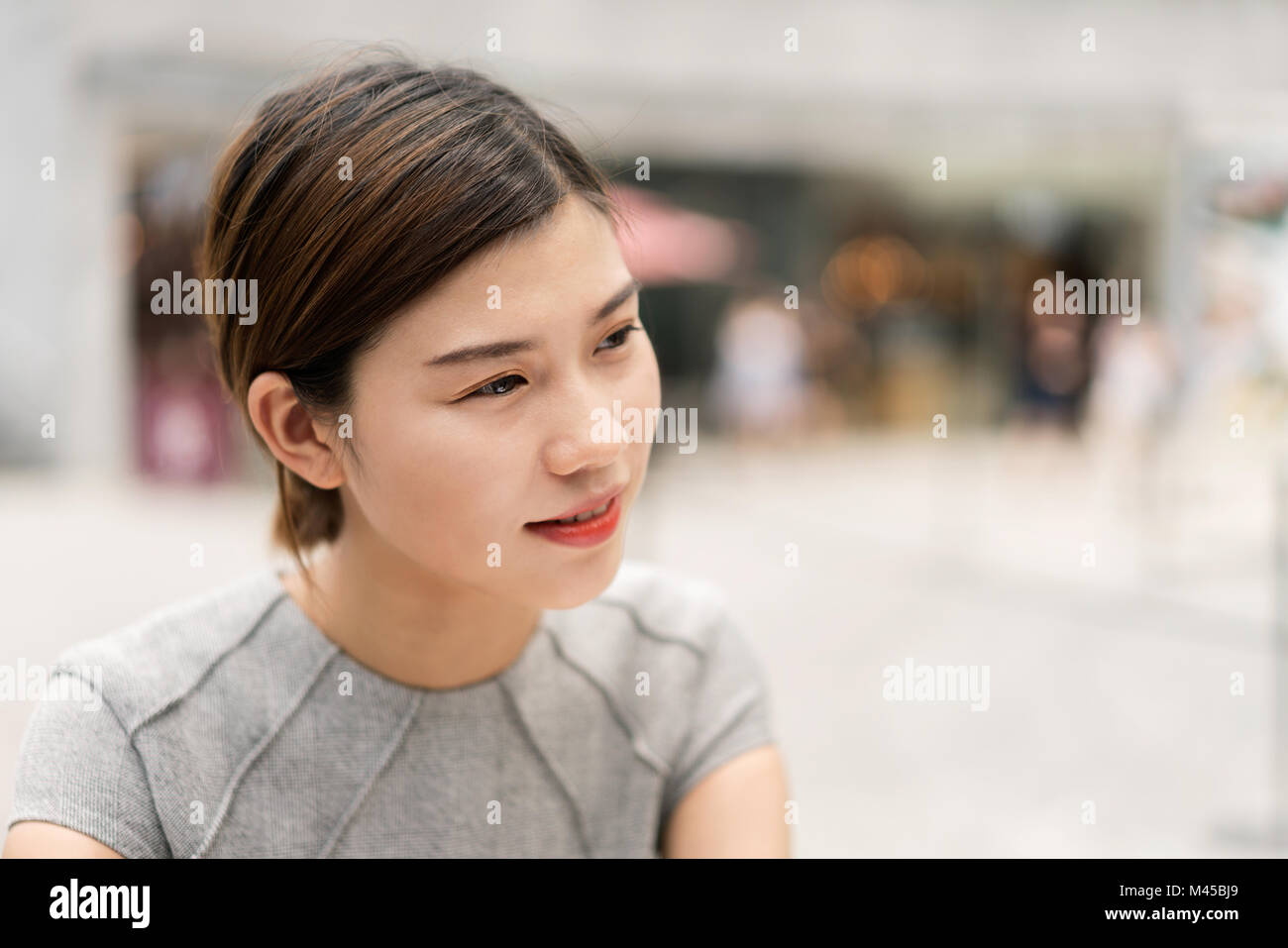 Young city businesswoman outdoors, head and shoulder Stock Photo