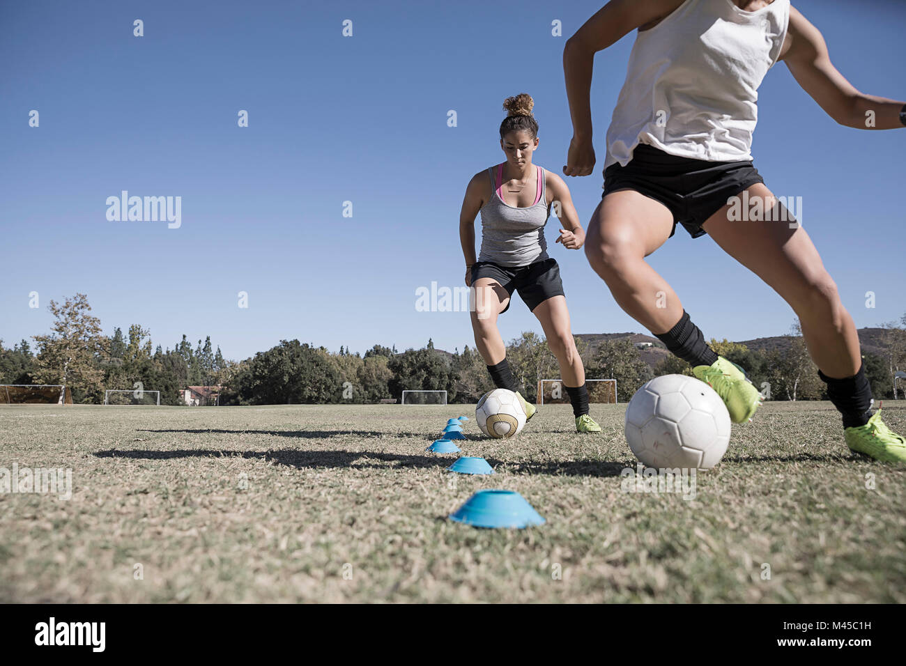 Women dribbling footballs Stock Photo Alamy