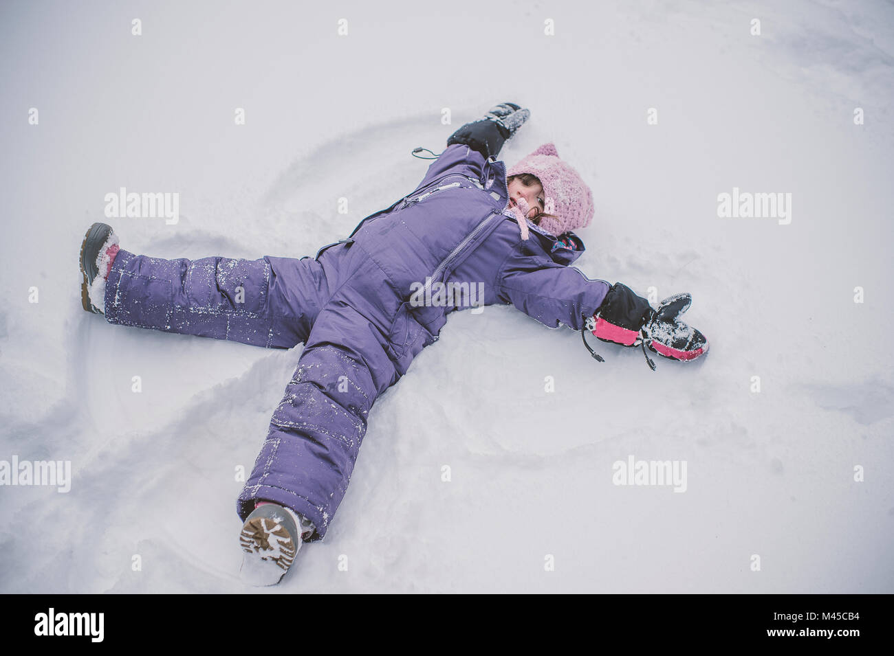 Young Girl Making Snow Angel In Snow Stock Photo Alamy Young Girl Making Snow Angel In Snow Stock Photo Alamy