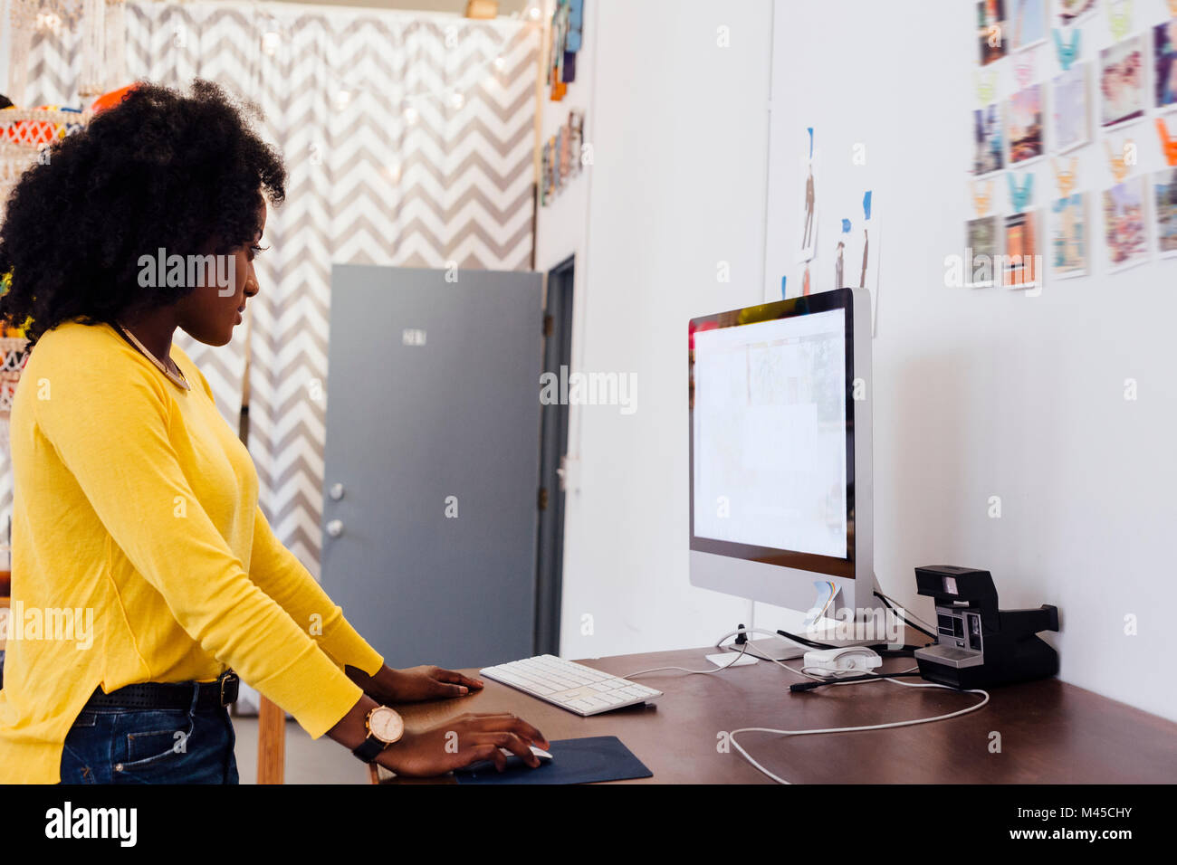 Woman in creative studio using computer Stock Photo - Alamy