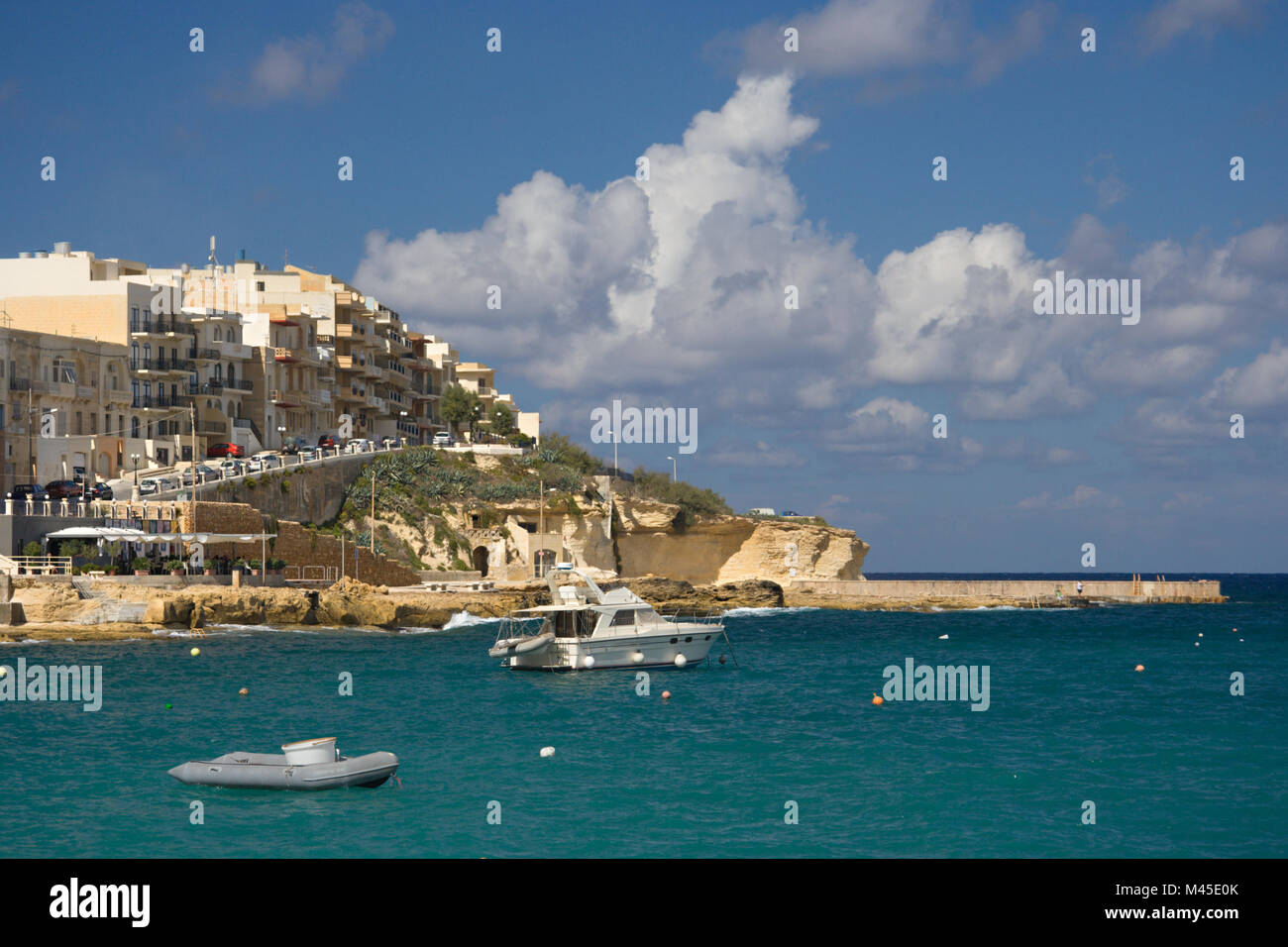 Boats and coastline of the bay of Marsalforn, Gozo. Stock Photo