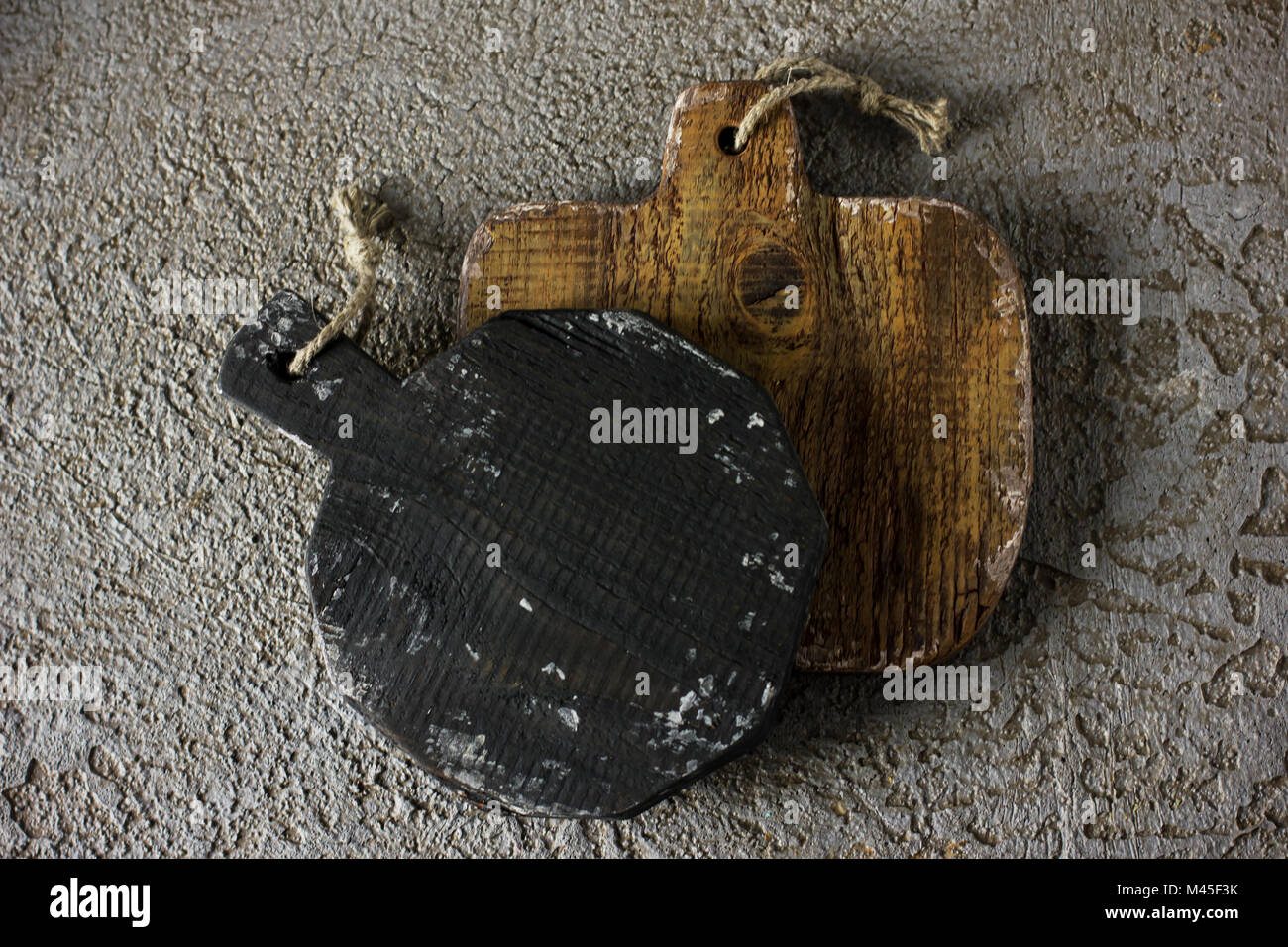 Wooden cutting boards on grey concrete background. Props for food photography Stock Photo