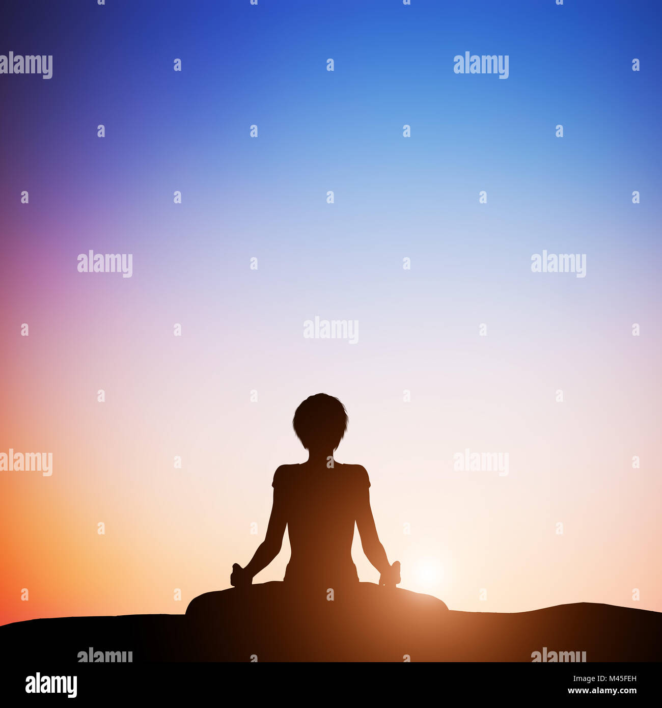 Woman in lotus yoga pose meditating at sunset. Zen Stock Photo