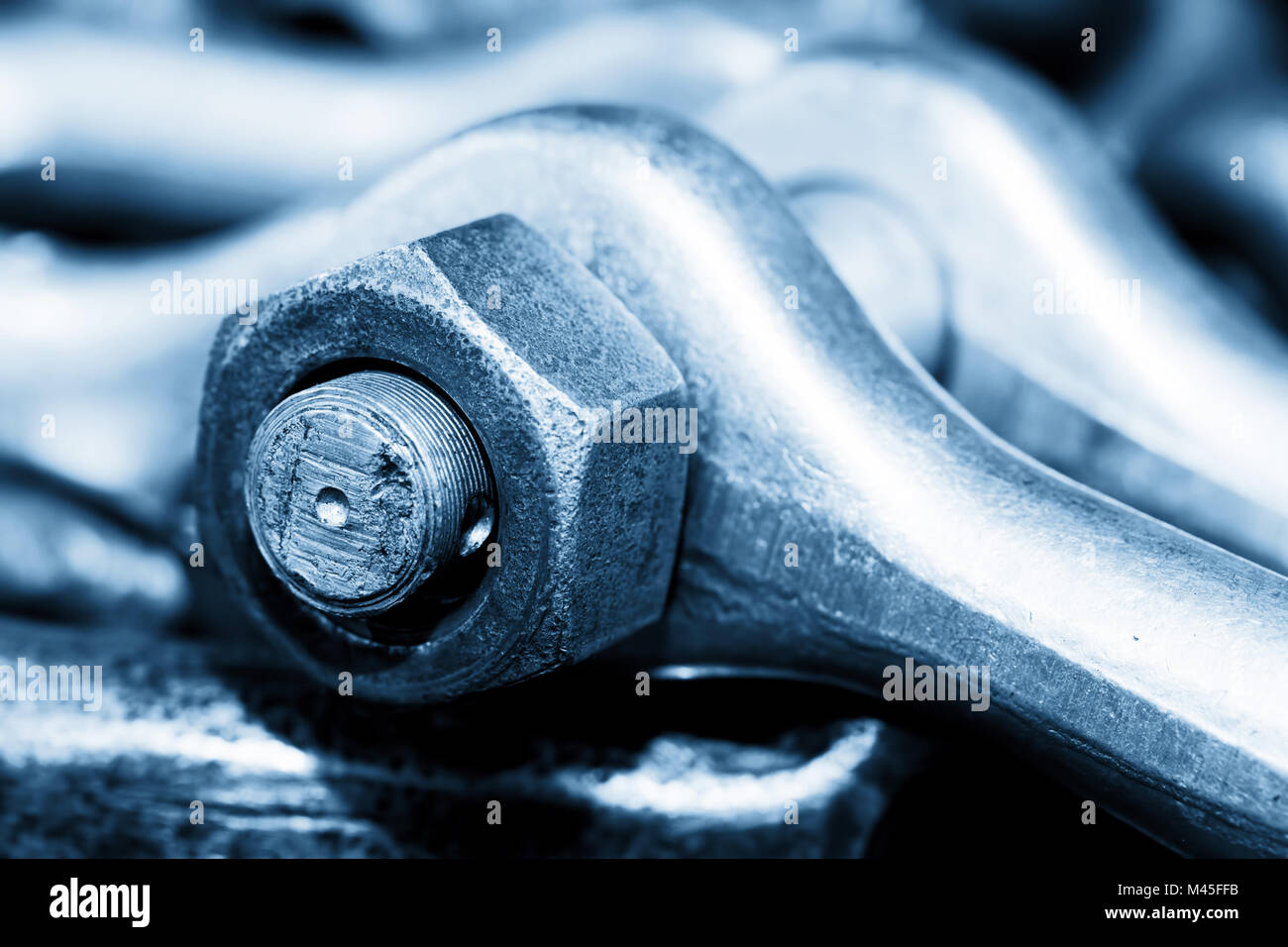 Industrial wrench, spanner in workshop. Industry theme. Stock Photo