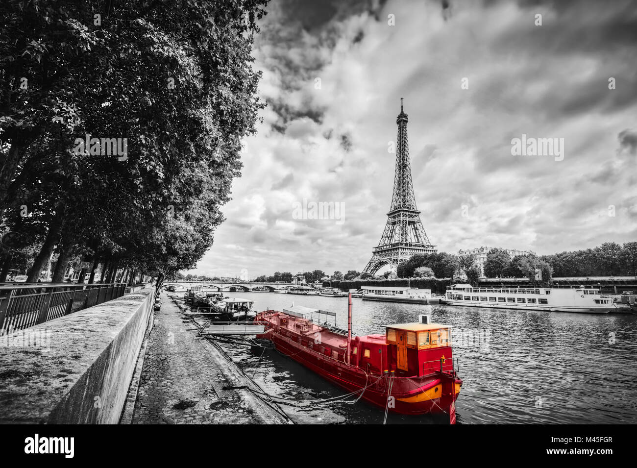 Eiffel Tower over Seine river in Paris, France. Vintage Stock Photo