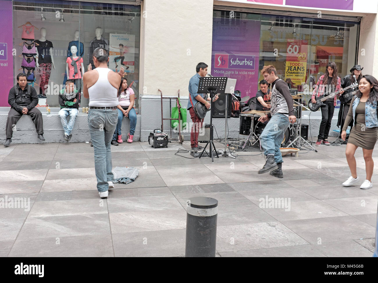 Street musicians entertain on a sidewalk in the Centro Historico district in Mexico City, Mexico. Stock Photo