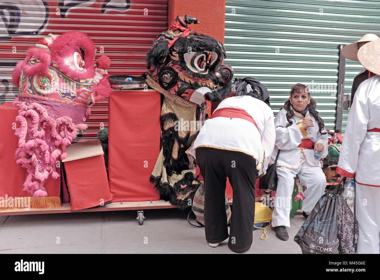 Women participating in the New Year celebration in Mexico City, Mexico Chinatown take a break from the festivities. Stock Photo