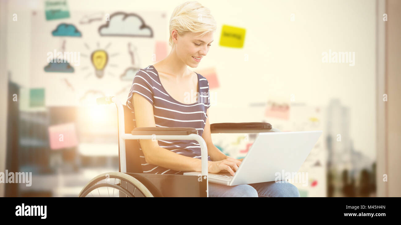 Composite image of woman in wheelchair using computer Stock Photo - Alamy