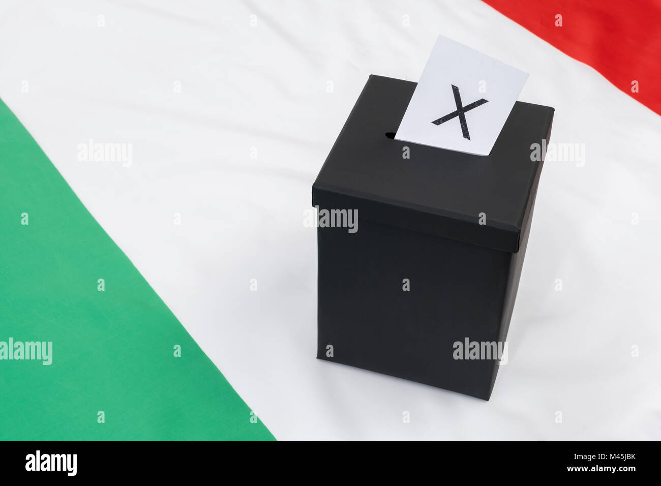 Black ballot box on Italian flag as metaphor for Italian general