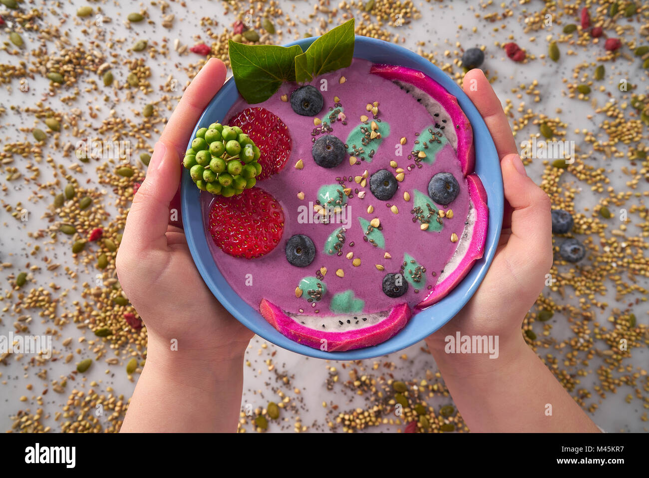 Acai bowl smoothie with chia strawberry blueberry seeds and pitaya ...