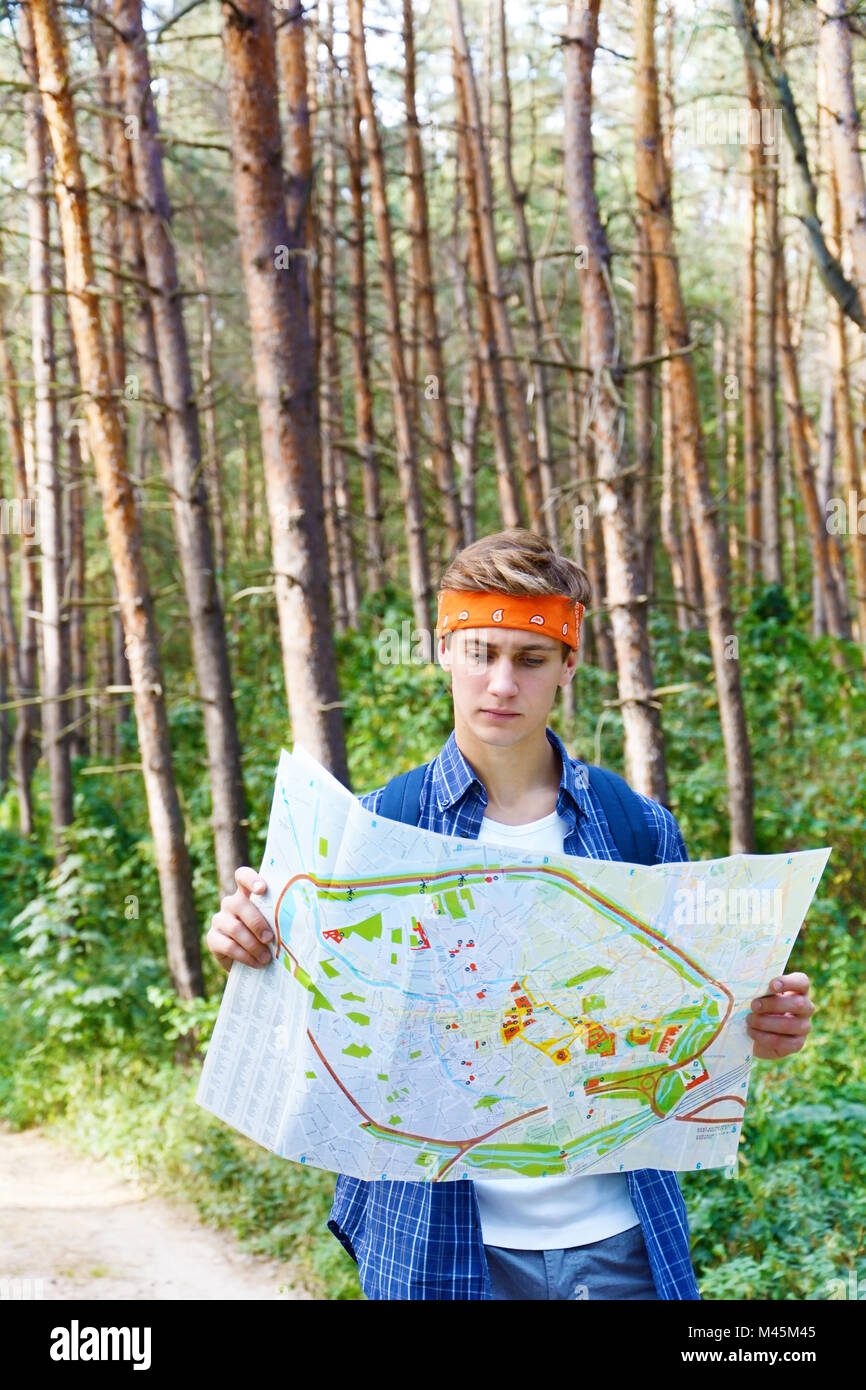 Young man is exploring the map Stock Photo