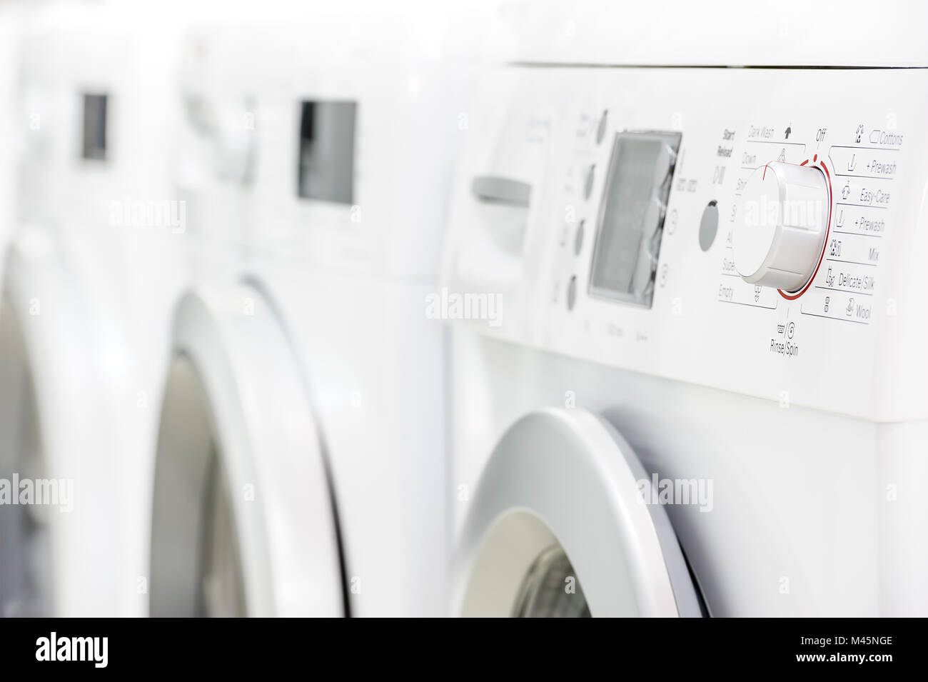 line of laundry machines Stock Photo
