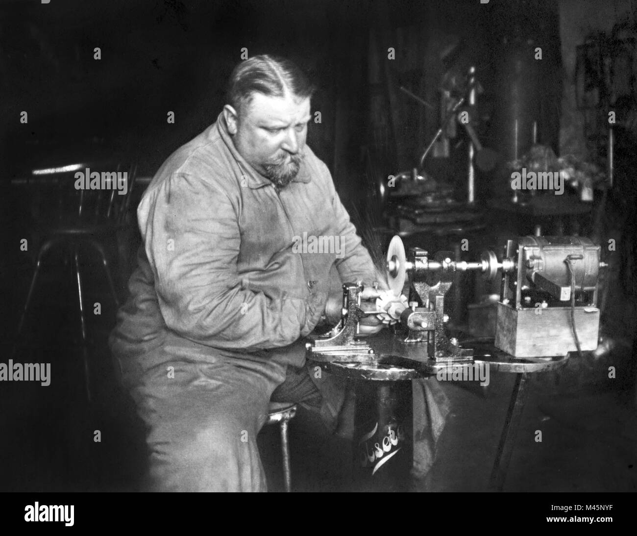 Handicraft,fat man working on a grinding machine,ca. 1930s,exact place unknown,Germany Stock Photo