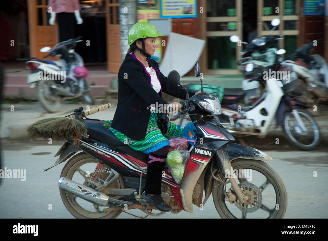 girl riding motorcycle in skirt