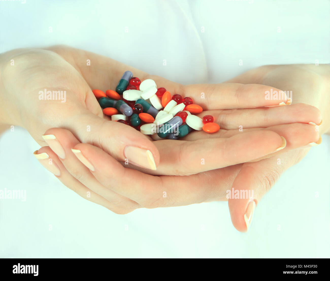 Medication In Hand Woman holding pills in hand hi-res stock photography and images - Alamy