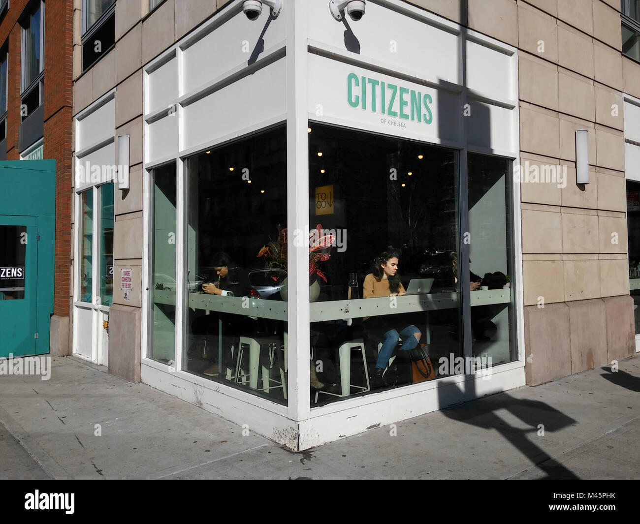 Customers on their various devices in the Citizens of Chelsea Coffee shop in Chelsea in New York on Tuesday, February 13, 2018. (Â© Richard B. Levine) Stock Photo