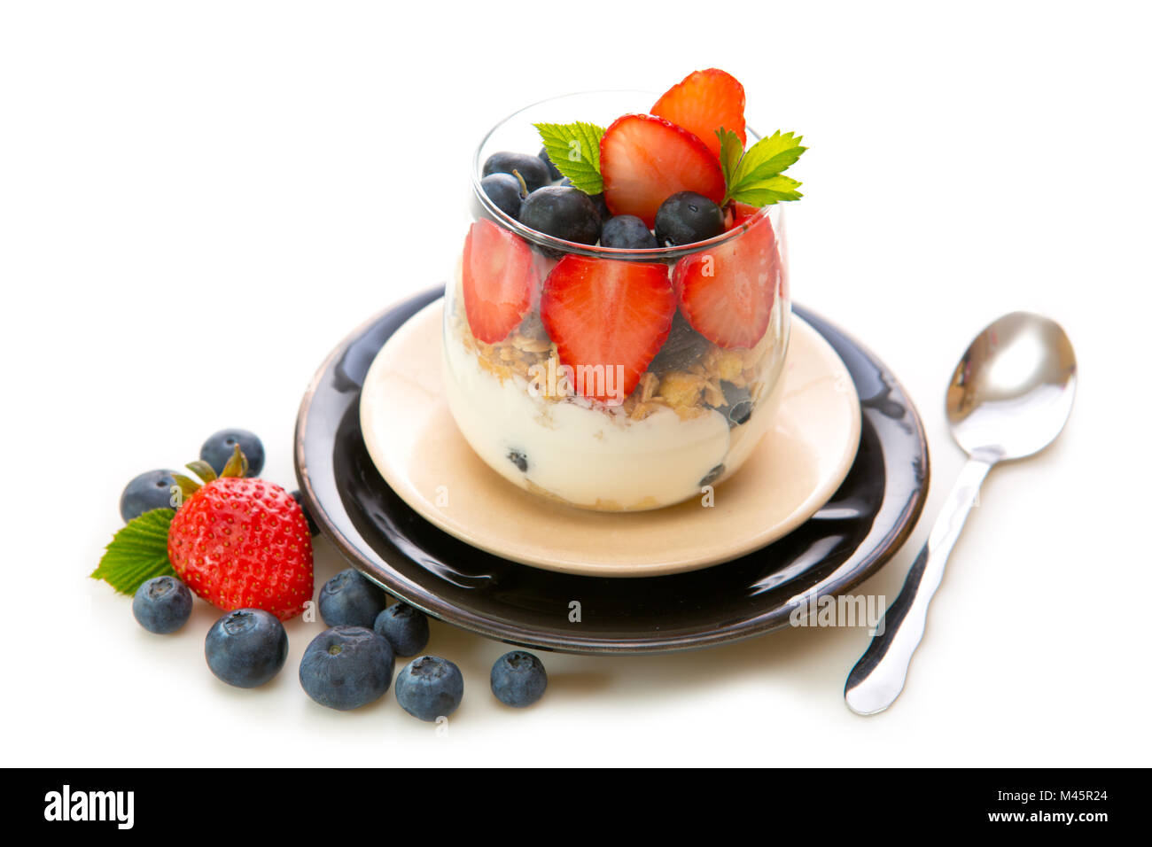 Fresh Yogurt with strawberries and blueberries. Stock Photo