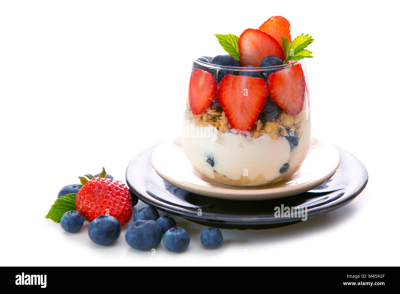 Fresh Yogurt with strawberries and blueberries. Stock Photo