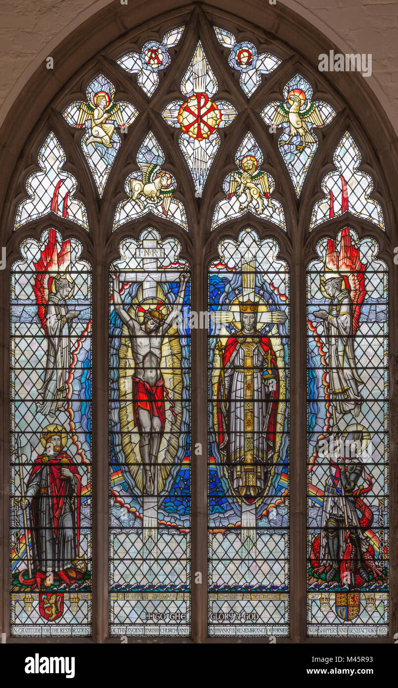 LONDON, GREAT BRITAIN - SEPTEMBER 20, 2017: The Jesus on the cross and as the King on the stained glass in church St. Olave  by A. E. Buss (1953). Stock Photo