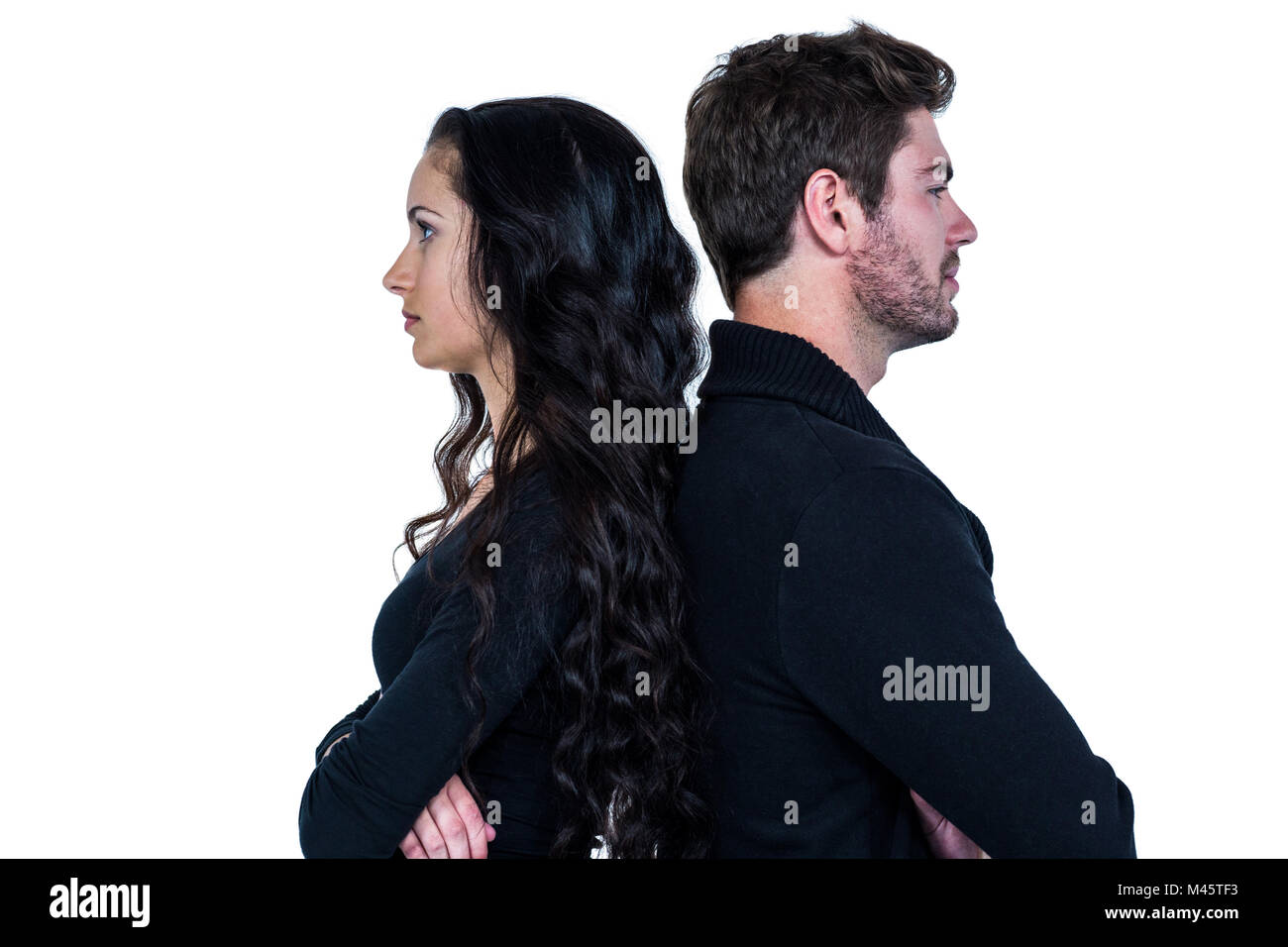 Couple back to back not talking after an argument Stock Photo