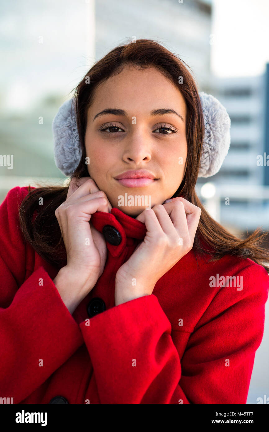 Portrait of women wearing coat and ear muffs Stock Photo