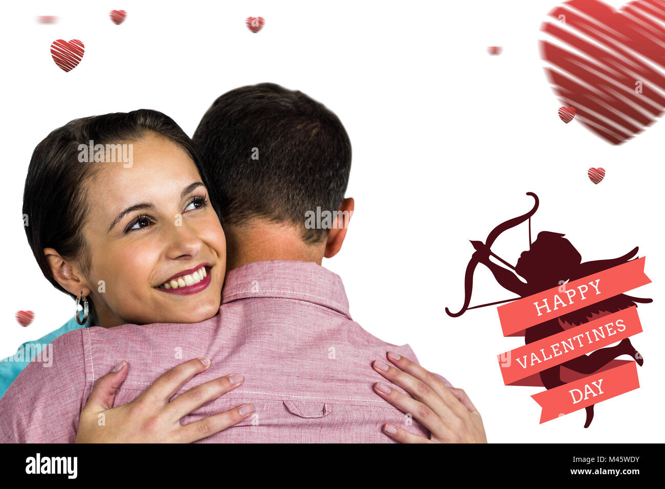 Composite image of beautiful woman hugging boyfriend Stock Photo - Alamy