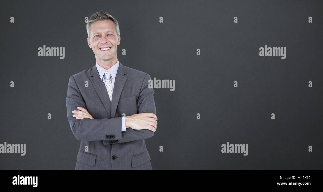 Composite image of portrait of smiling businessman standing arms ...