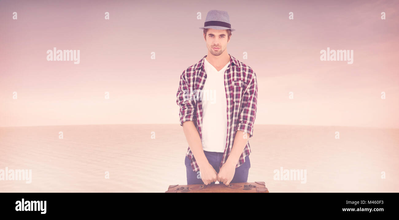 Composite image of confident man holding briefcase Stock Photo