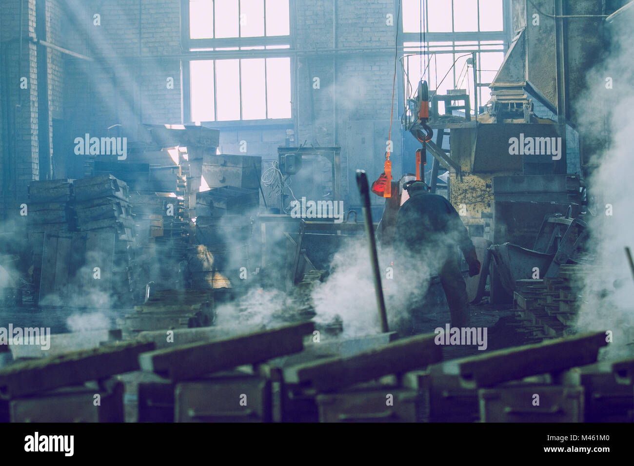 Cesis, Latvia, Metal foundry, workers pour metal, factory in city Cesis 2011. Stock Photo