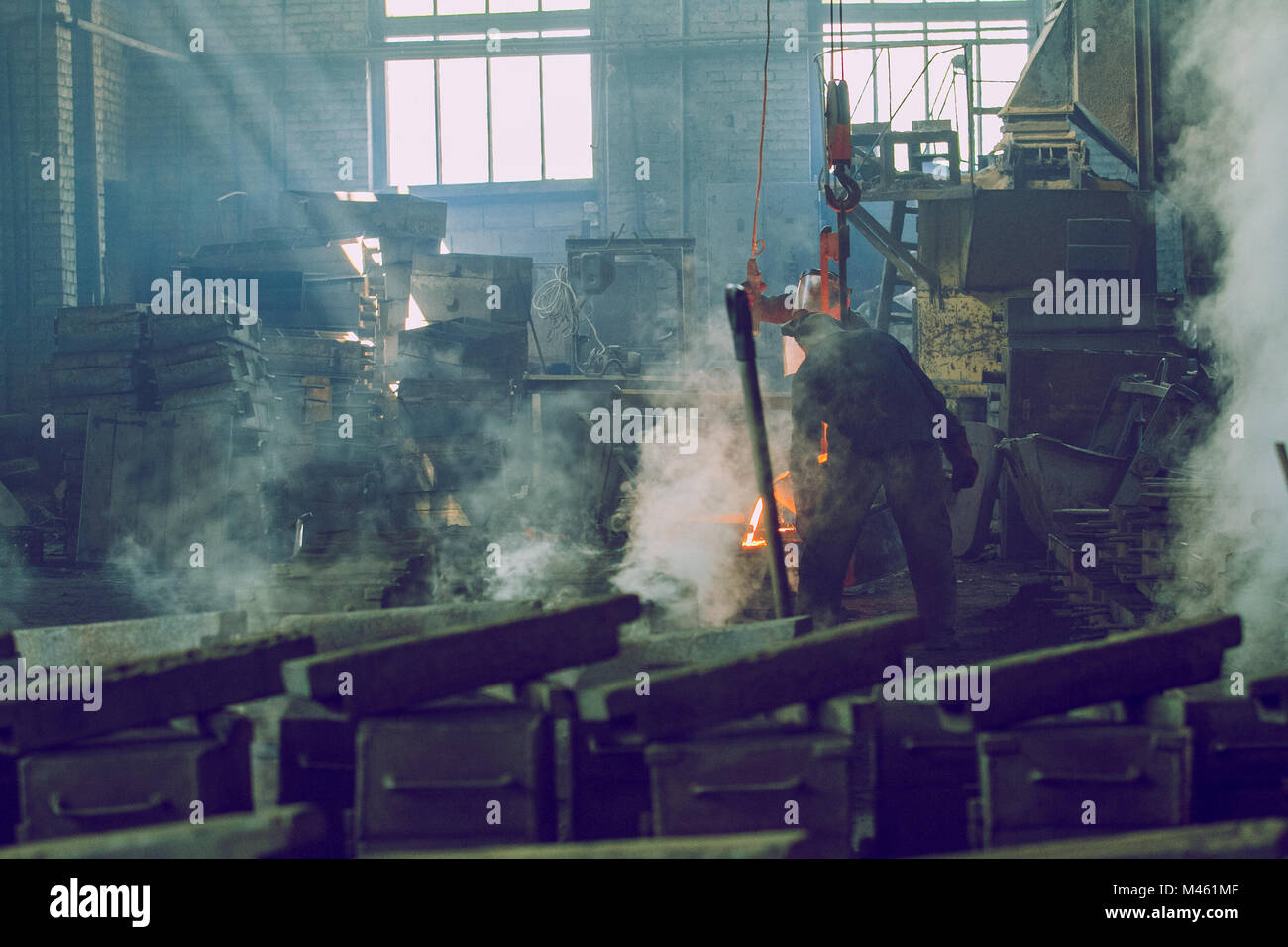 Cesis, Latvia, Metal foundry, workers pour metal, factory in city Cesis 2011. Stock Photo
