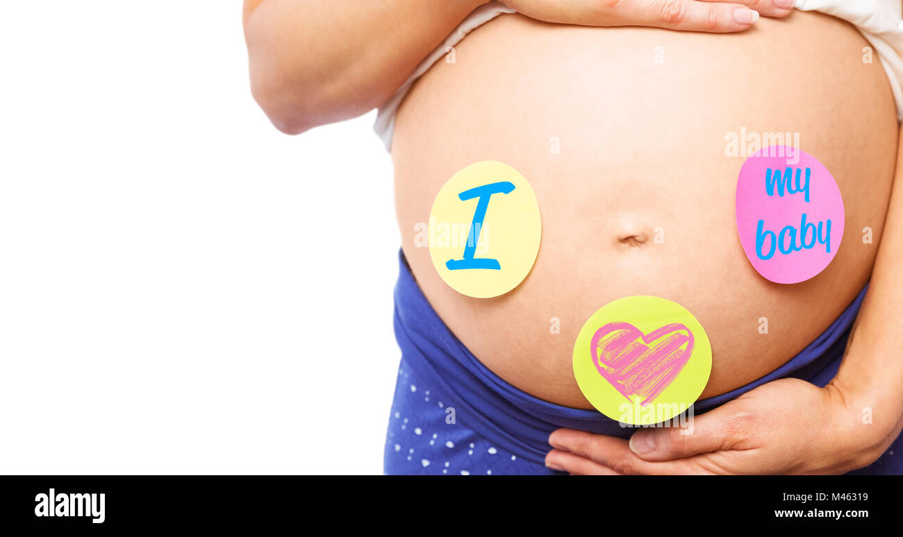 Composite image of pregnant woman with stickers on bump Stock Photo