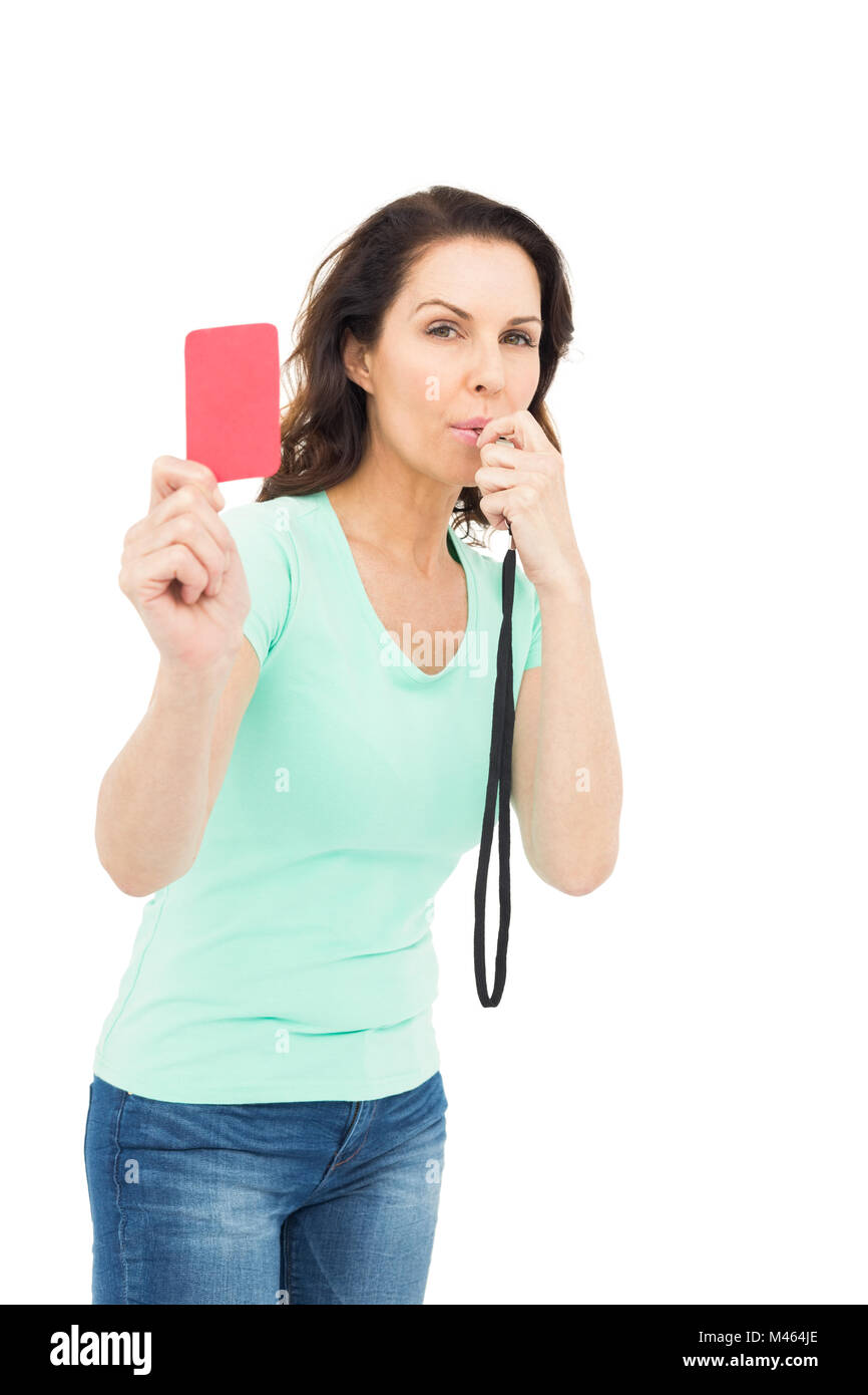 Mature woman blowing whistle and holding red card Stock Photo Alamy