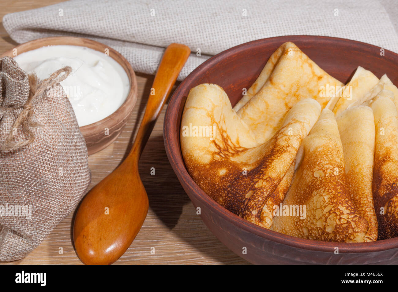 Tasty traditional russian breakfast of slapjack with honey on plate. Rustic  style. Space for your text and top view Stock Photo - Alamy
