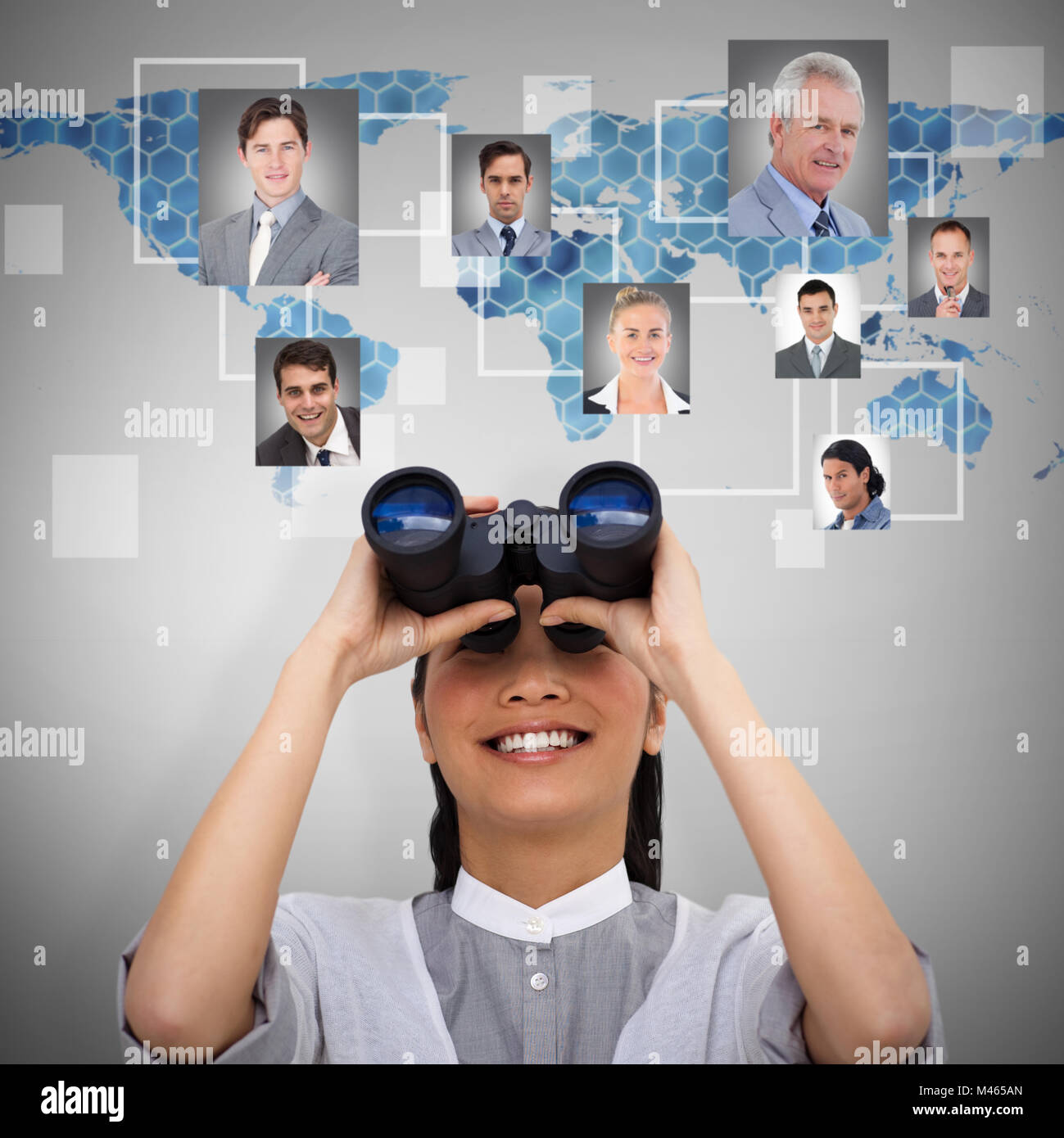 Composite image of visionary businesswoman looking through binoculars Stock Photo