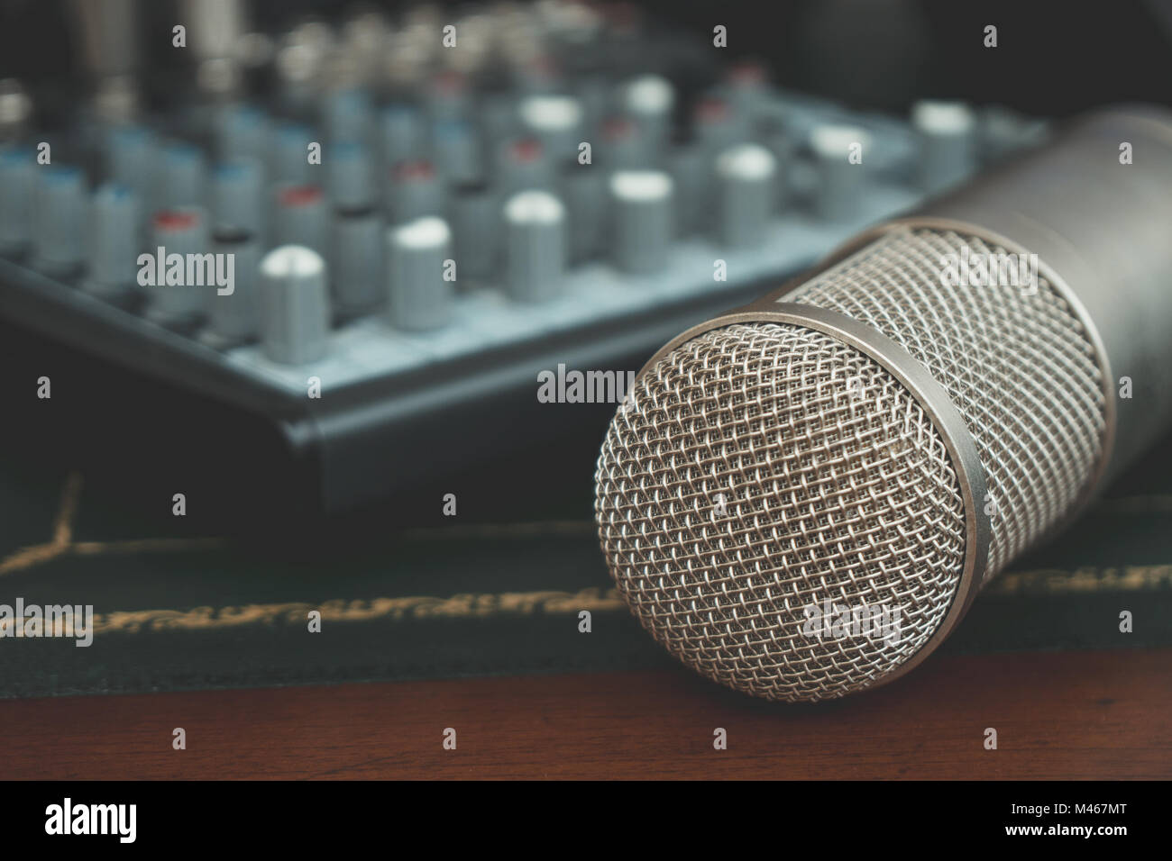 Mixer and condenser microphone. Concept of home music studio. Stock Photo