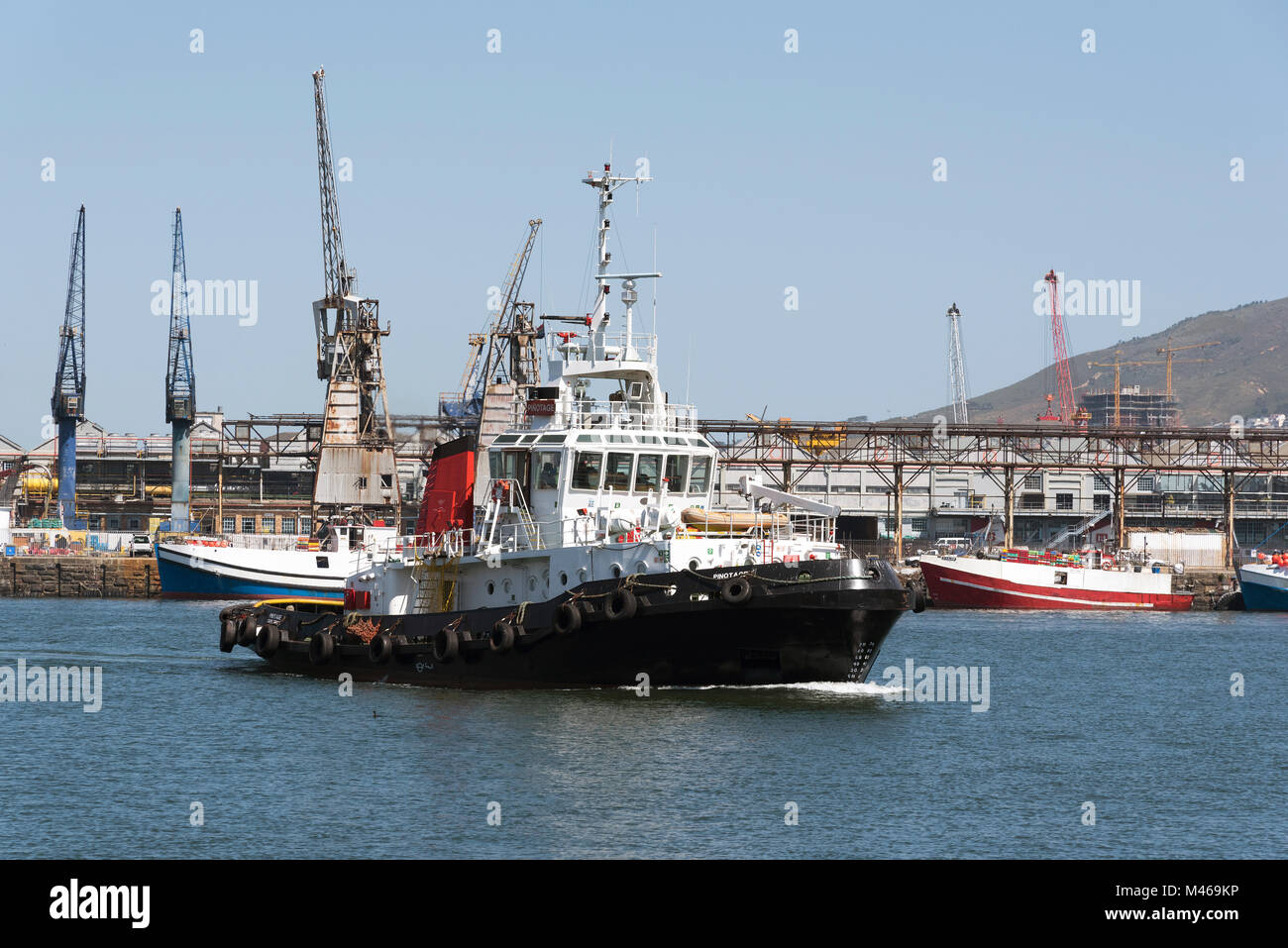 Ocean going tug underway on Cape Town harbour South Africa, Stock Photo