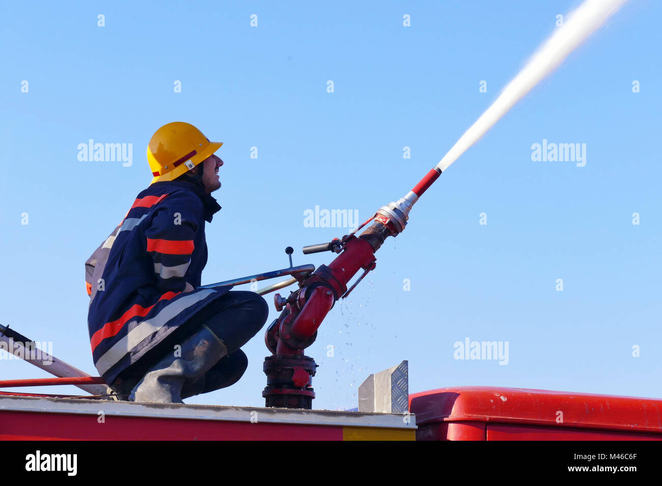 Fire fighting with water cannon Stock Photo