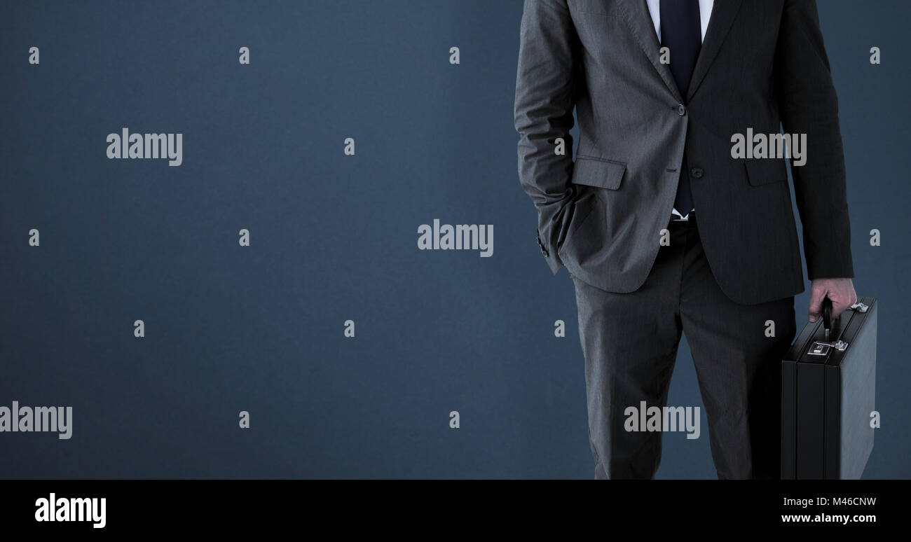 Composite image of businessman standing with his briefcase Stock Photo