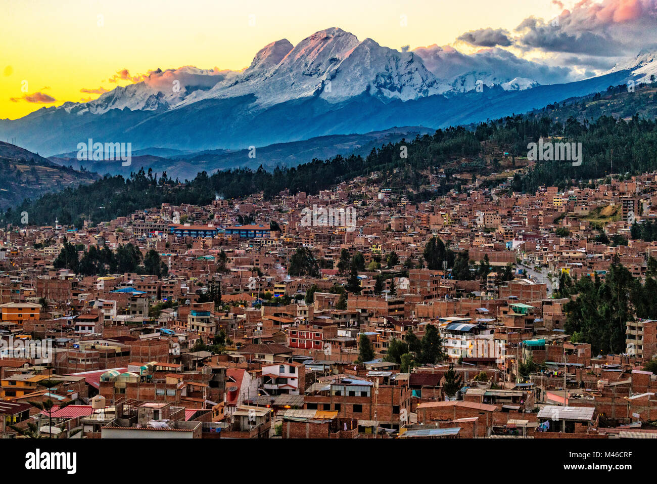 Overlooking the city of Huaraz during sunset, towards Huascaran the tallest mountain in Peru, South America. Stock Photo