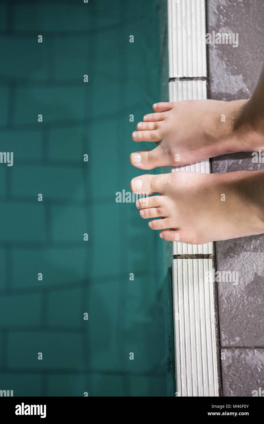 Feet of woman standing on the edge of the pool Stock Photo - Alamy