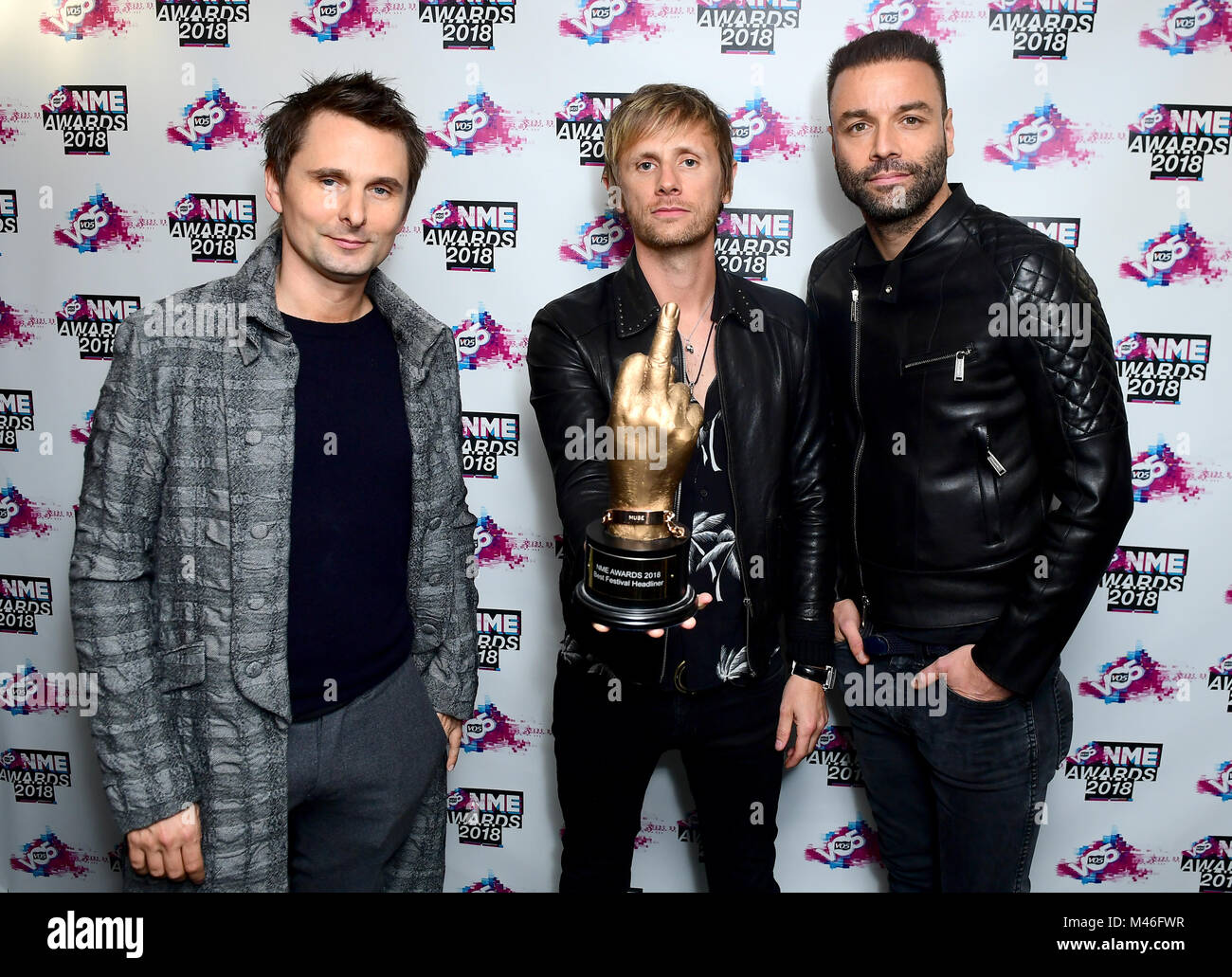 Matt Bellamy, Chris Wolstenholme and Dominic Howard of Muse holding the  award for Best International Band in the awards room at the VO5 NME Awards  2018 held at the O2 Brixton Academy,