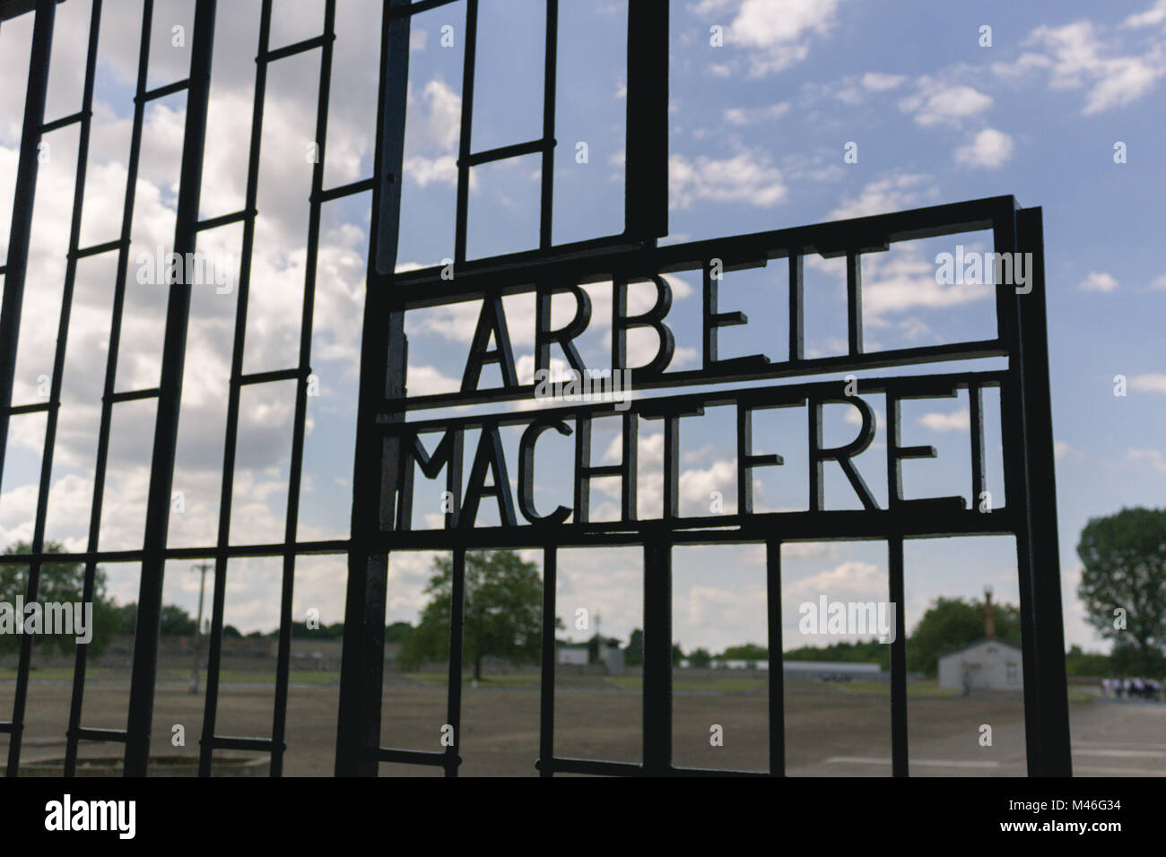 Gate from the German Concentration camp Sachsenhausen in Berlin, Germany. 'Arbeit macht frei' is a German phrase meaning 'work sets you free'. The slo Stock Photo