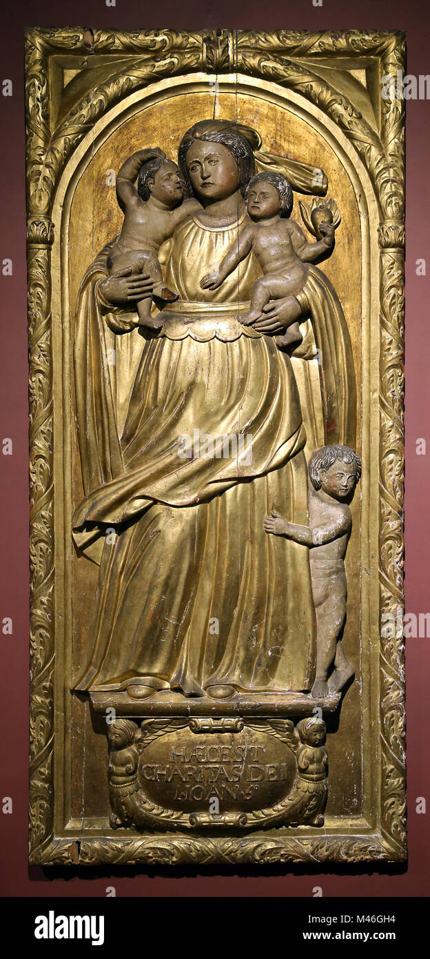 Allegory of Charity. Manuel Pereira and collaborators, Portugal, 1654. Polychrome and gilded wooden bas relief. Museo de Arte Sacra. Funchal. Stock Photo