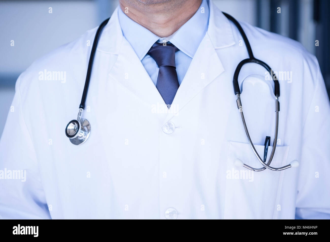 Male Doctor In Lab Coat Wearing Stethoscope Around Neck Stock Photo Alamy