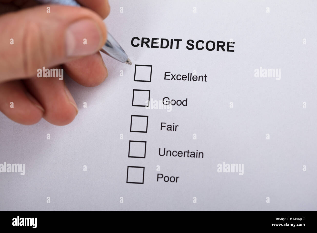 High Angle View A Person Filling Credit Score Form Stock Photo