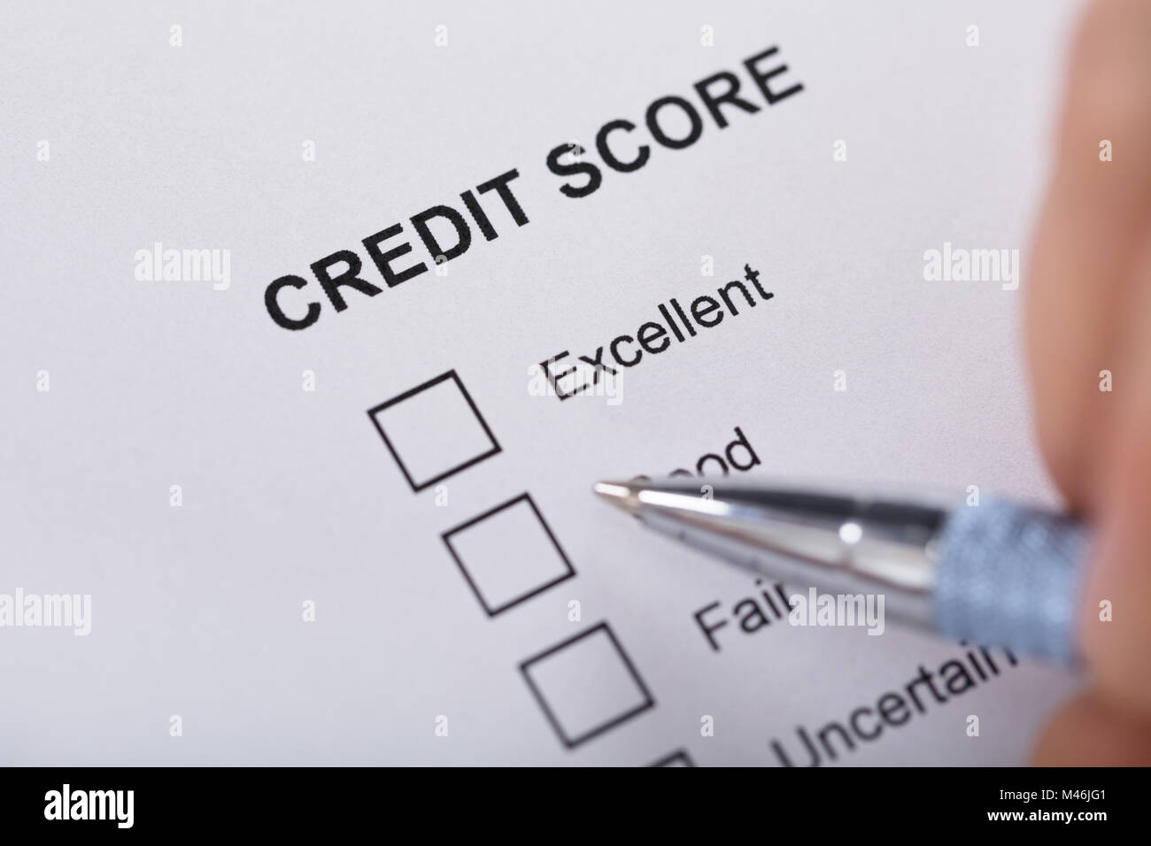 High Angle View A Person Filling Credit Score Form Stock Photo